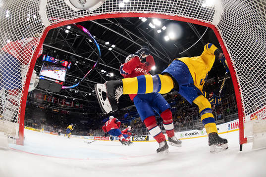 Christian Kåsastul of Norway tackles Adrian Kempe of Sweden
