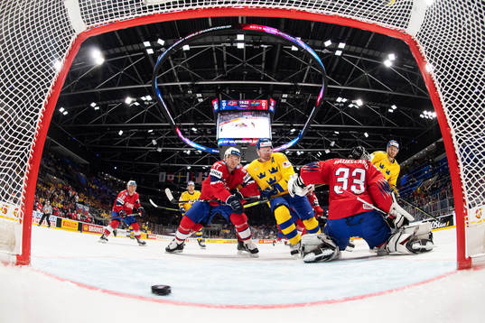 Alexander Wennberg (R) of Sweden scores 0-1 behind