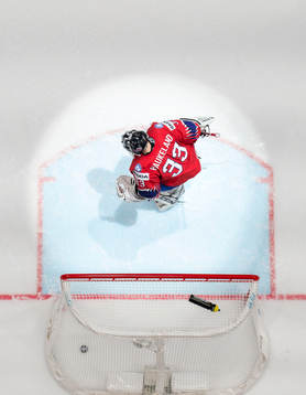 Goaltender Henrik Haukeland of Norway looks dejected