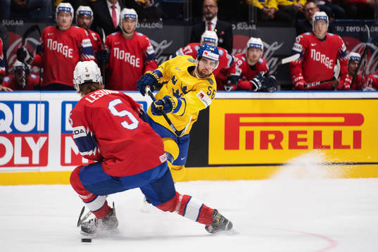 Erik Gustafsson of Sweden shoots the puck past Erlend