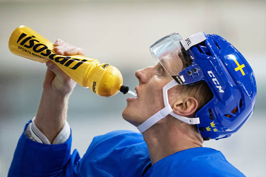 John Klingberg of Sweden drinks water at a practice session