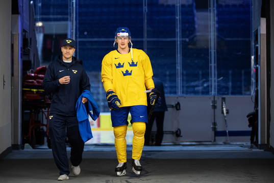 Physiotherapist Markus Hast and Philip Holm of Sweden at a