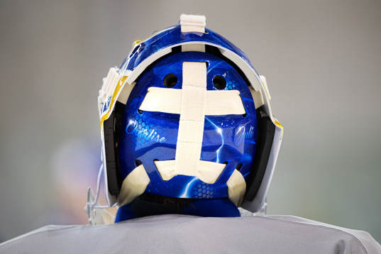 Goaltender Henrik Lundqvist of Sweden has his daughters