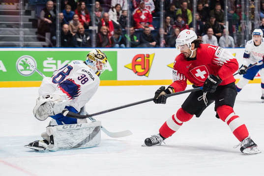 Andres Ambuhl of Switzerland scores 1-0 behind goaltender