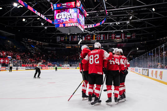 Players of Switzerland celebrate 1-0 by Andres Ambuhl