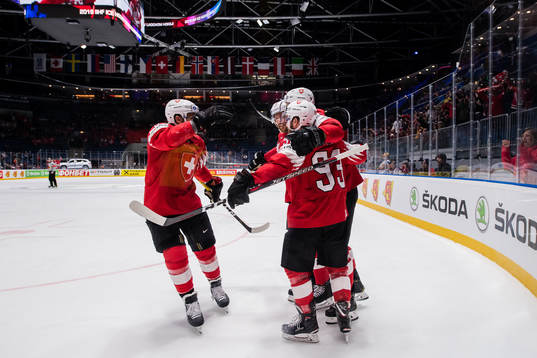 Gregory Hofmann of Switzerland celebrates with teammates