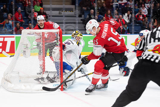 Gregory Hofmann (R) of Switzerland scores 3-0 behind