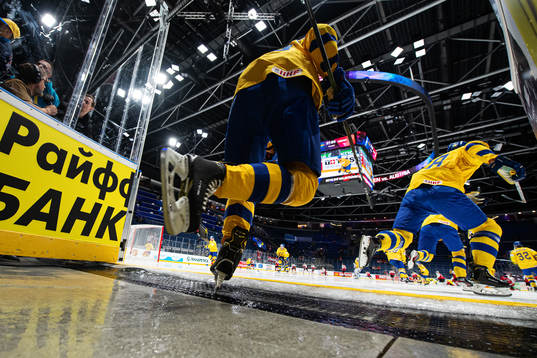 Players of Sweden enter the ice for warm-up