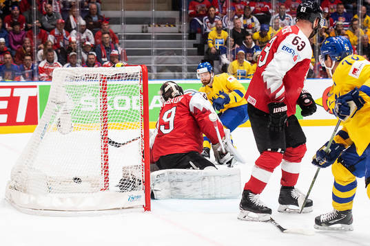 Adam Larsson of Sweden scores 4-0 behind goaltender