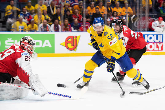Anton Lander of Sweden and goaltender Bernhard Starkbaum of