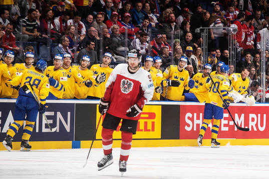 Elias Lindholm and Elias Pettersson celebrates with