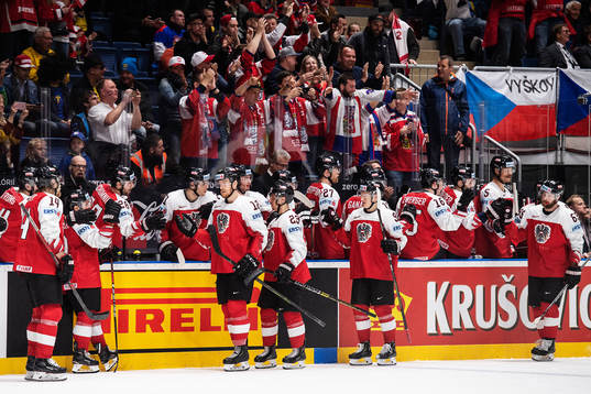 Michael Raffl of Austria celebrates with teammates
