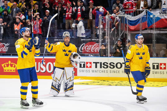 Oliver Ekman Larsson and goaltender Henrik Lundqvist of