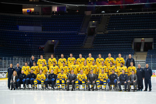 Players and team staff of Sweden pose for a team photo at a