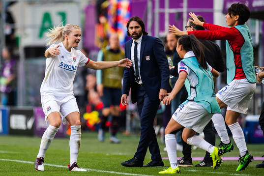 Ada Hegerberg of Lyon celebrate with teammates and Reynald