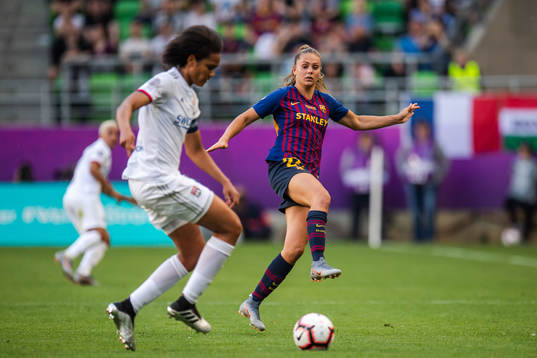 Wendie Renard of Lyon and Lieke Martens of Barcelona