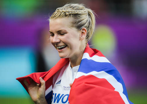 Ada Hegerberg of Lyon celebrates with a Norwegian flag