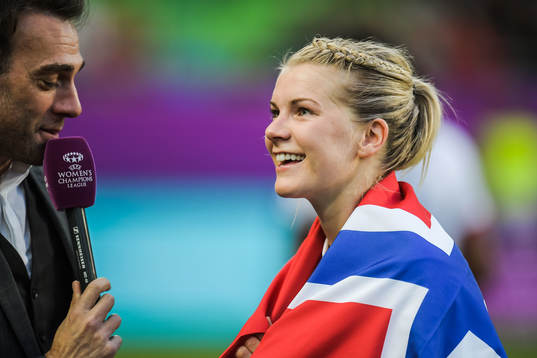 Ada Hegerberg of Lyon celebrates with a Norwegian flag