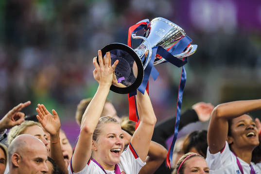 Ada Hegerberg of Lyon lifts the trophy