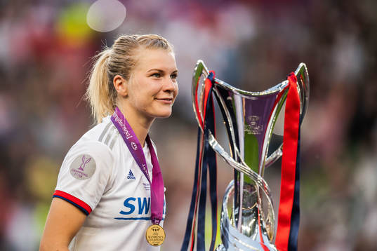 Ada Hegerberg of Lyon celebrates with her gold medal and