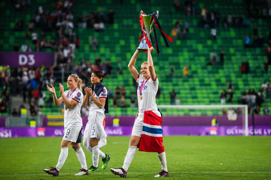 Ada Hegerberg of Lyon lifts the trophy