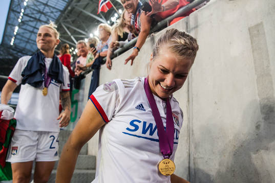 Ada Hegerberg of Lyon celebrates with her gold medal