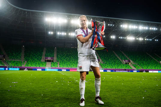 Ada Hegerberg of Lyon poses for a portrait with the trophy