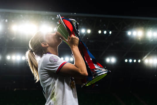 Ada Hegerberg of Lyon poses for a portrait with the trophy
