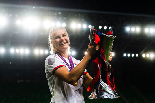 Ada Hegerberg of Lyon poses for a portrait with the trophy