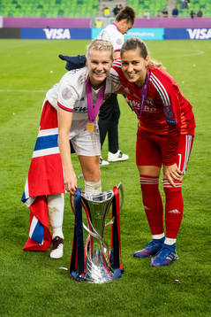 Ada Hegerberg and goalkeeper Lisa Weiss of Lyon celebrate