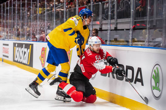 Loui Eriksson of Sweden and Christoph Bertschy of