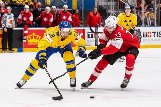 Anton Lander of Sweden and Nico Hischier of Switzerland