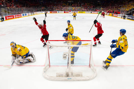 Tristan Scherwey and Gaetan Haas of Switzerland celebrate