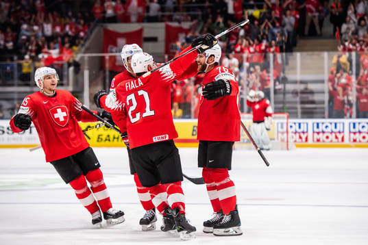Joel Genazzi of Switzerland celebrate with teammates