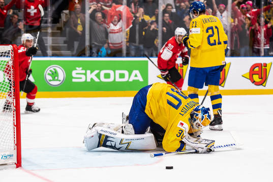 Goaltender Henrik Lundqvist of Sweden looks dejected