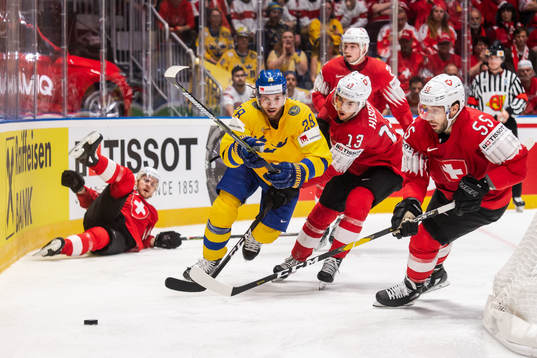 Elias Lindholm of Sweden against Nico Hischier and Romain