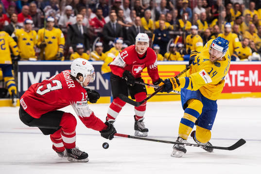 Nico Hischier of Switzerland and Mattias Ekholm of Sweden