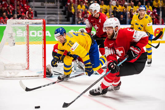 Patric Hörnqvist of Sweden and Yannick Weber of Switzerland