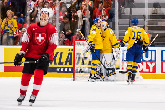 Roman Josi of Switzerland looks dejected while Anton Lande,