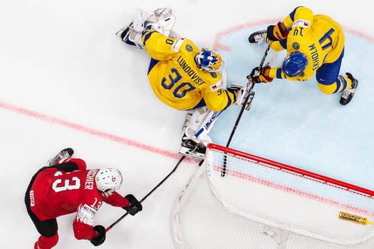 Nico Hischier of Switzerland tries to score behind