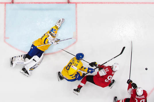 Goaltender Henrik Lundqvist and Marcus Pettersson of Sweden