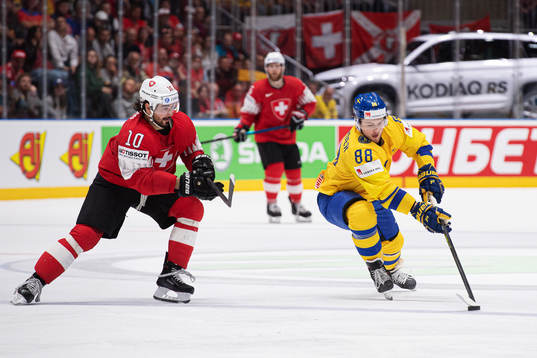 Andres Ambuhl of Switzerland and William Nylander of Sweden
