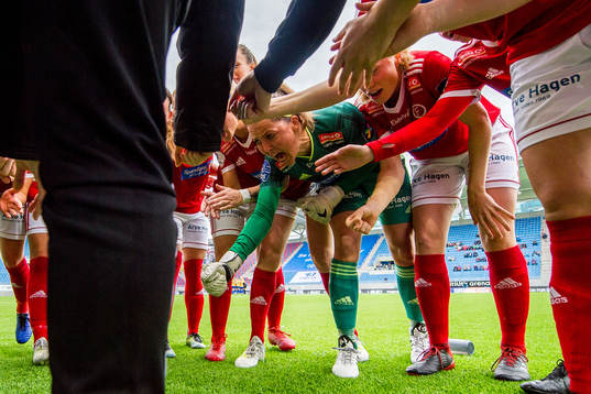 Goalkeeper Lene Lauve of Fart and her teammates gather in a
