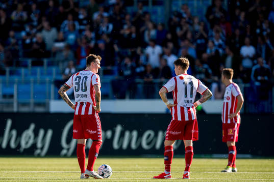 Runar Espejord and Robert Taylor look dejected