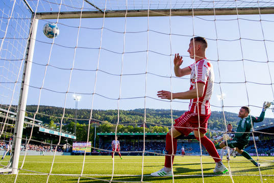 Martin Rønning Ovenstad of Strømsgodset scores 2-1 behind