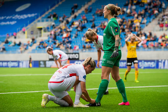 Stine Hovland and goalkeeper Nora Gjøen of Sandviken