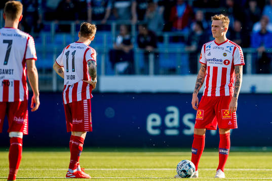 Robert Taylor and Runar Espejord of Tromsø look dejeceted