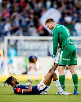 Amahl Pellegrino of Strømsgodset and goalkeeper Gudmund
