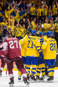 Elias Pettersson of Sweden celebrates with team mates