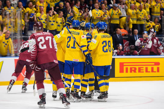 Elias Pettersson of Sweden celebrates with team mates